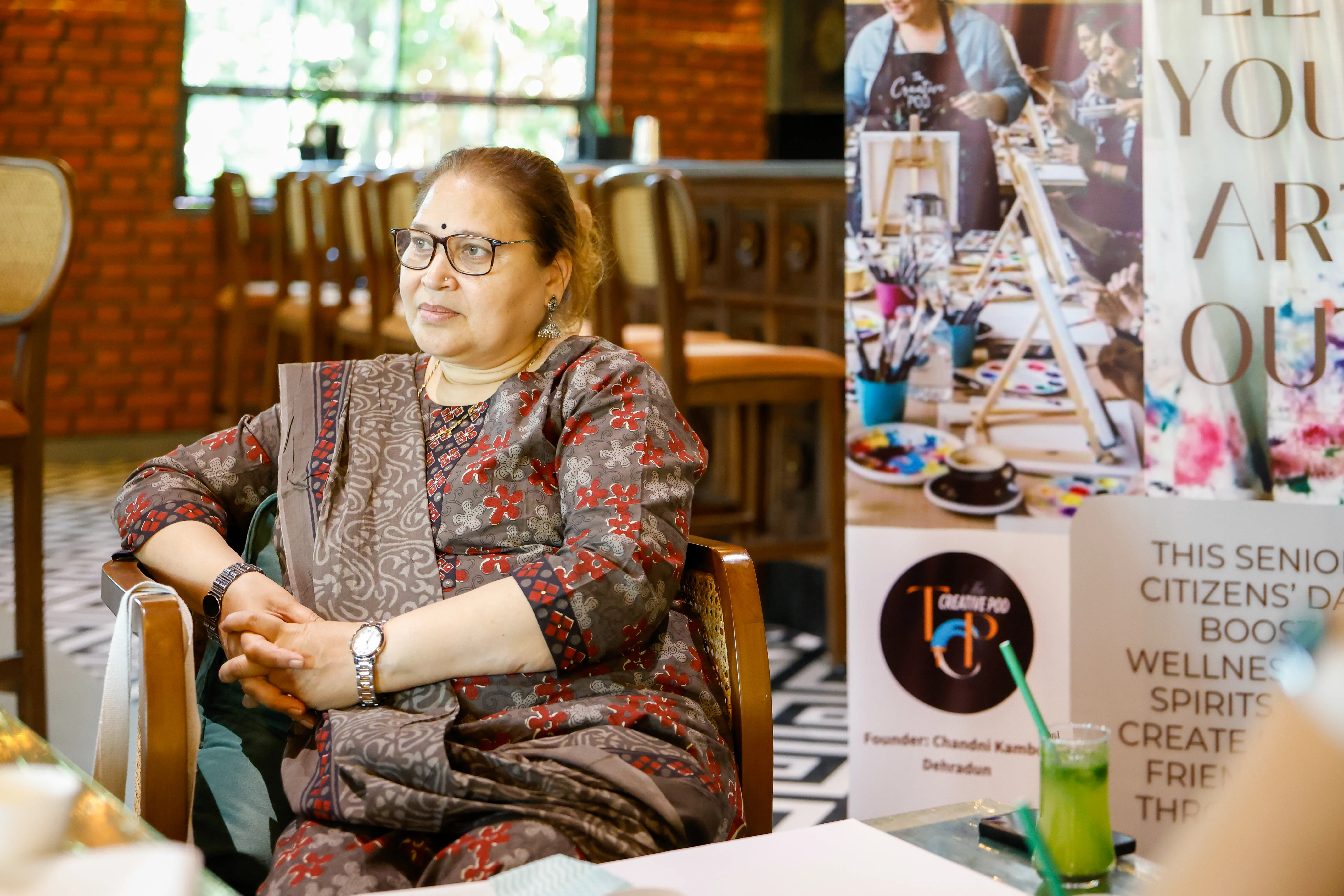 Senior participant creating artwork in Art Beyond Age studio workshop, Dehradun
